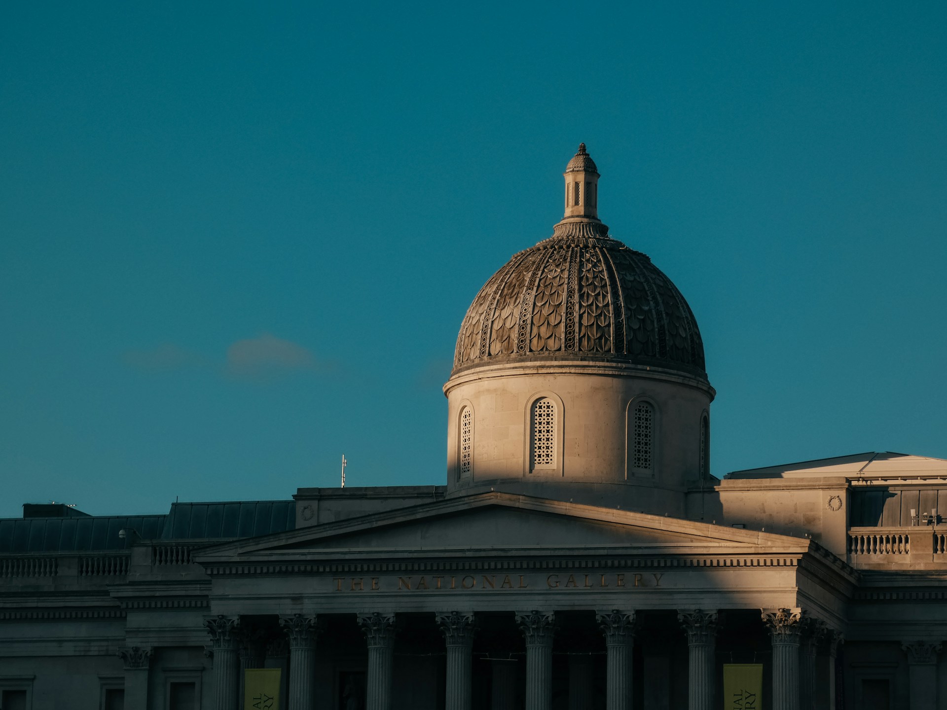 Domed neoclassical building against dusk sky